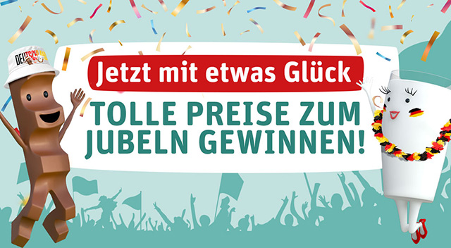 Milky und Schoki stehen jeweils rechts und links von einem Schild mit der Aufschrift "Jetzt mit etwas glück tolle Preise zum Jubeln gewinnen" mit Konfetti aussen rum, wobei beide ihre Arme jubelnd nach oben strecken und Milky eine Blumenkette in Deutschlandfarben umhängen hat, sowie auf den Wangen rechts und links die Deutschlandfahne abgebildet hat. Schoki trägt einen Fischerhut mit kinder-Logo, Deutschland-Schriftzug und Milky & Schoki-Abbildung